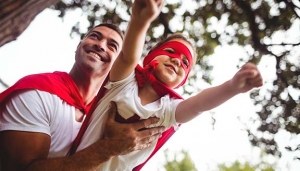 Father and daughter pretending to be a superhero