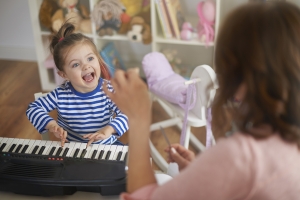 Daughter & mom playing instruments