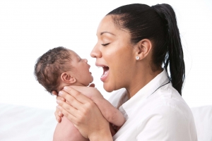 Real People: Mother Holding Talking to Baby Boy African American